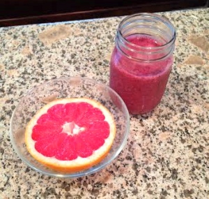 grapefruit with a smoothie containing: frozen strawberries, frozen blueberries, strawberry greek yogurt, banana, oats, and orange juice.